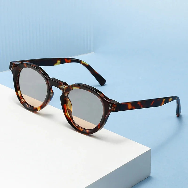 JNPCXI New Fashion Small Round Sunglasses Women Shades Fashion Leopard Blue Lens Men Trending Rivets Frame UV400