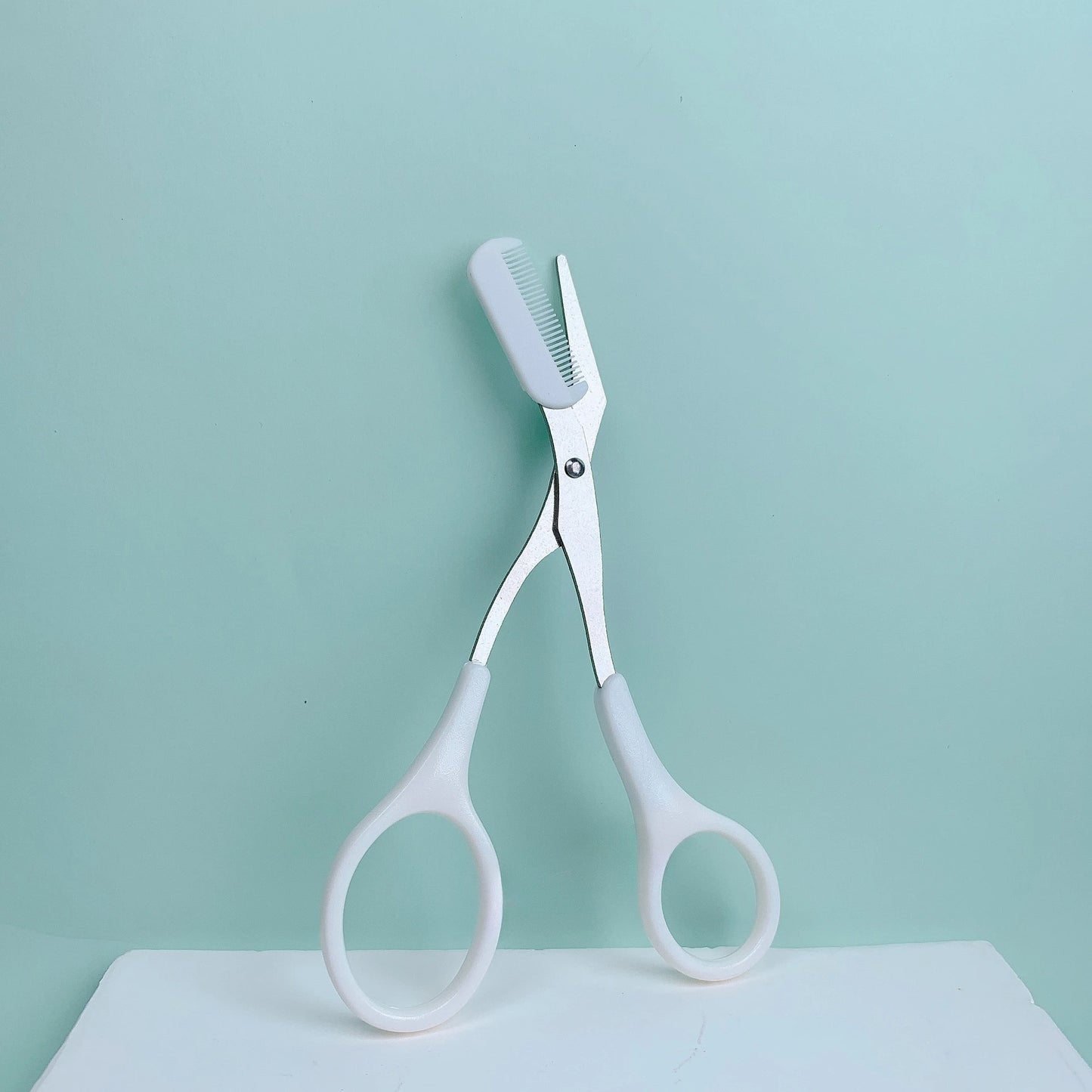 Pink eyebrow trimming scissors w/ built-in comb, precise grooming tool