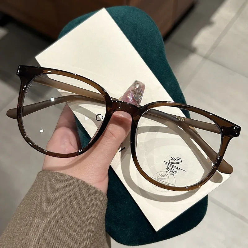 Photochromic Anti Radiation Glasses for Men and Women Simple Oval Anti-blue Transition Eyeglasses Outdoor Shade Sunglasses