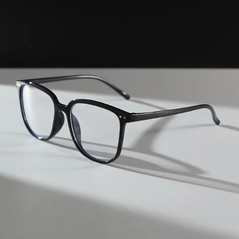A Pair of Women'S Plastic Geometric Oversized Frames with a Minimalist And Casual Style, Featuring Plain Lenses.